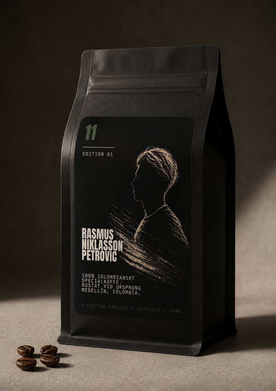 11 Kaffe Edition 01 coffee bag, front — matte black pouch with the silhouette mark and jersey number 11